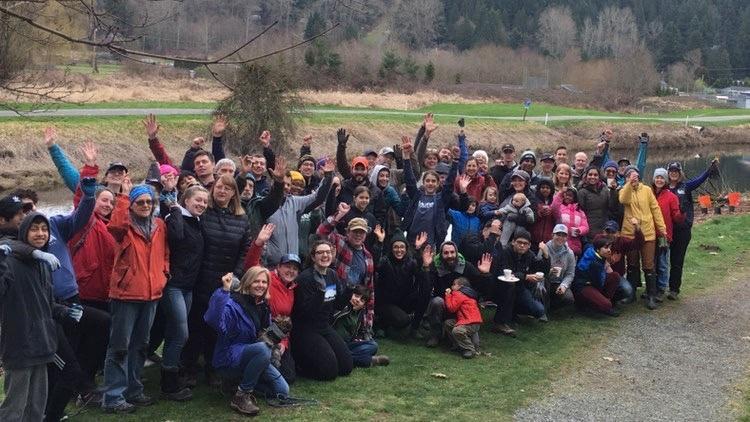 Big group of people together at planting site